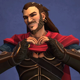 A Man With Long Hair And A Beard Is Making A Heart With His Hands GIF