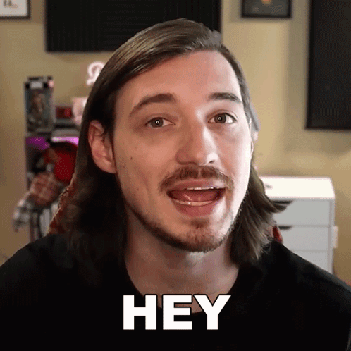 Man With Long Hair And Beard Saying Hey GIF