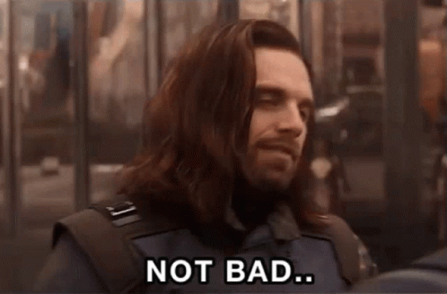 A Man With Long Hair And A Beard Is Smiling And Saying Not Bad GIF