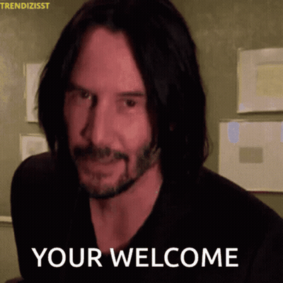 A Man With Long Hair And A Beard Is Smiling And Says " Your Welcome " GIF
