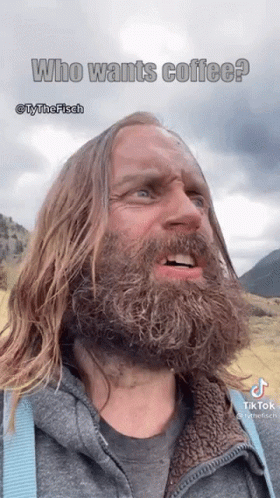 A Man With Long Hair And A Beard Is Talking About Coffee GIF