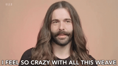 A Man With Long Hair And A Beard Is Talking About His Hair . GIF