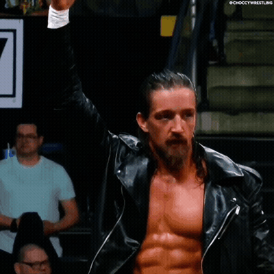 A Man With Long Hair And A Beard Is Wearing A Black Leather Jacket And Giving The Middle Finger GIF