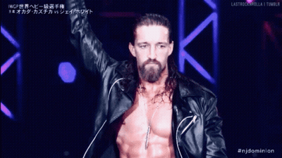 A Man With Long Hair And A Beard Is Wearing A Black Leather Jacket And Necklace GIF