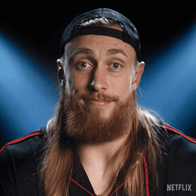 A Man With Long Hair And A Beard Is Wearing A Hat And A Shirt That Says Netflix GIF
