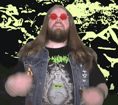 A Man With Long Hair And A Beard Is Wearing A Shirt That Says Psycho On It GIF