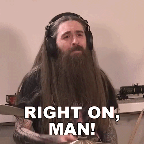 A Man With Long Hair And A Beard Is Wearing Headphones And Says Right On Man GIF