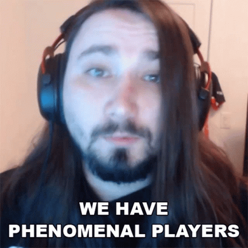 A Man With Long Hair And A Beard Is Wearing Headphones And Says " We Have Phenomenal Players " GIF