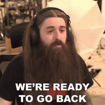A Man With Long Hair And A Beard Is Wearing Headphones And Says We 'Re Ready To Go Back GIF