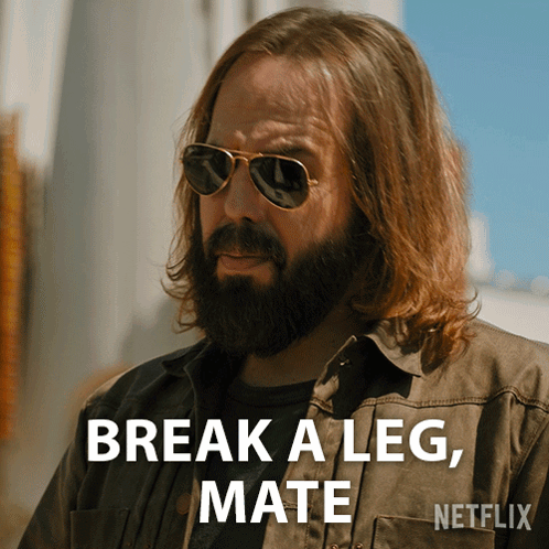 A Man With Long Hair And A Beard Is Wearing Sunglasses And Says " Break A Leg Mate " GIF