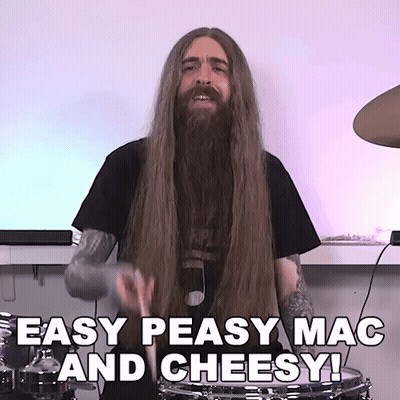 A Man With Long Hair And A Beard Playing Drums With The Words Easy Peasy Mac And Cheesy Below Him GIF