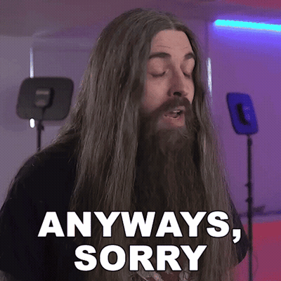 a man with long hair and a beard saying anyways sorry