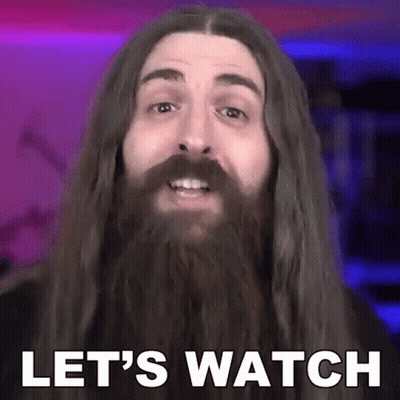 A Man With Long Hair And A Beard Saying Let 'S Watch GIF