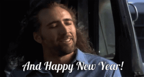 A Man With Long Hair And A Beard Says " And Happy New Year " While Sitting In A Truck GIF