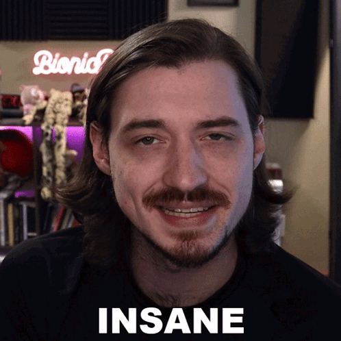 Man With Long Hair And Beard Saying Insane GIF