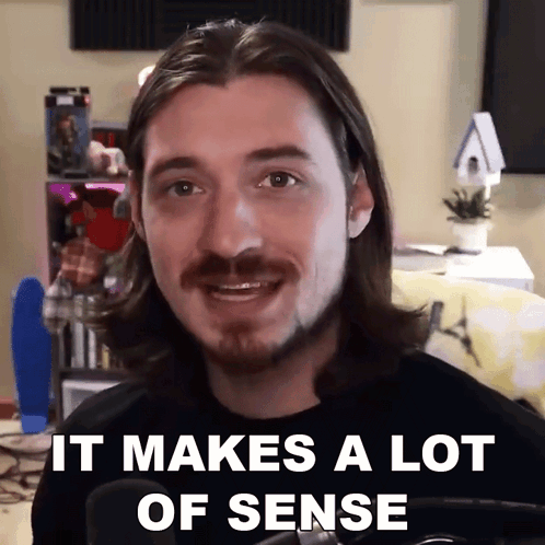A Man With Long Hair And A Beard Says " It Makes A Lot Of Sense " In Front Of A Microphone GIF