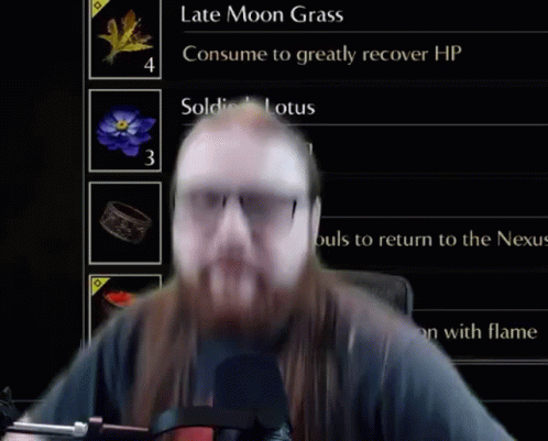 Man With Long Hair And Beard In Front Of Screen GIF