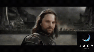 A Man With Long Hair And A Beard Stands In Front Of The Jacy Family Logo GIF