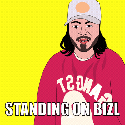 A Man With Long Hair And A Beard Wearing A Red Shirt That Says T2ma Standing On Bizl GIF