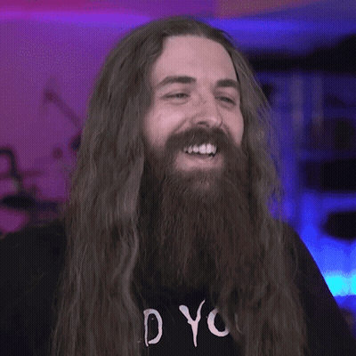 A Man With Long Hair And A Beard Wearing A Shirt That Says " Do You " GIF