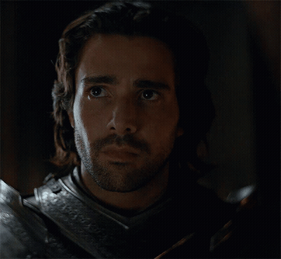 A Man With Long Hair And A Beard Wearing Armor GIF