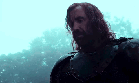 A Man With Long Hair And A Beard Wearing Armor GIF