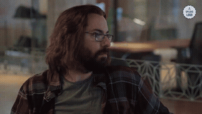 A Man With Long Hair And A Beard Wearing Glasses And A Plaid Shirt That Says Upload Link GIF