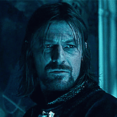 A Man With Long Hair And A Beard With The Words Blue Is Coming On His Face GIF