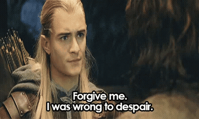 A Man With Long Hair And A Bow And Arrow Is Talking To Another Man . GIF