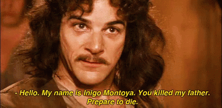 A Man With Long Hair And A Mustache Is Talking To Someone . GIF