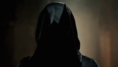 A Man With Long Hair And A Mustache Is Wearing A Cape GIF