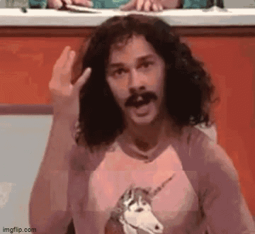 A Man With Long Hair And A Mustache Is Wearing A Unicorn Shirt And Making A Funny Face . GIF