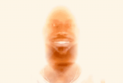 A Man With Long Hair And A Nfl Logo On His Neck GIF
