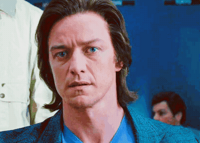A Man With Long Hair And Blue Eyes Is Wearing A Blue Jacket And Blue Shirt GIF