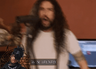 A Man With Long Hair And The Name Scarlxrd GIF