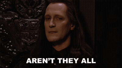 A Man With Long Hair Has The Words Aren 'T They All Below Him GIF
