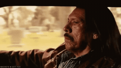 A Man With Long Hair Is Driving A Car With His Eyes Closed . GIF