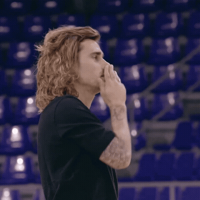 A Man With Long Hair Is Giving A Thumbs Up GIF