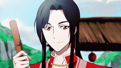 A Man With Long Hair Is Holding A Wooden Stick And Smiling . GIF
