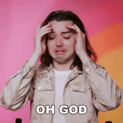A Man With Long Hair Is Holding His Head With The Words Oh God Written Above Him GIF