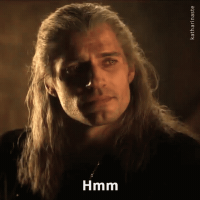 A Man With Long Hair Is Making A Funny Face And Saying Hmm GIF