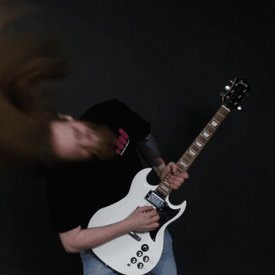 A Man With Long Hair Is Playing A White Guitar GIF