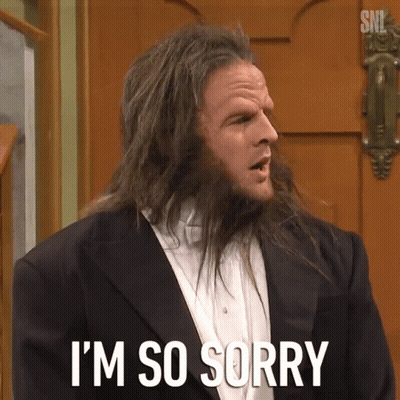 A Man With Long Hair Is Saying I 'M So Sorry In Front Of A Door GIF