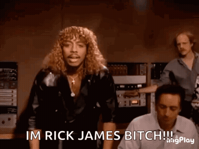 A Man With Long Hair Is Saying Im Rick James Bitch .. GIF