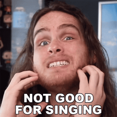 A Man With Long Hair Is Scratching His Face With The Words Not Good For Singing GIF