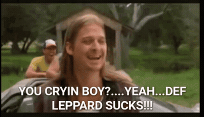A Man With Long Hair Is Sitting In A Car And Says You Cryin Boy Yeah Def Leppard Sucks ! GIF