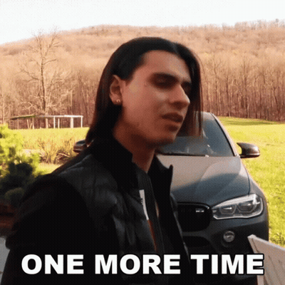 A Man With Long Hair Is Standing In Front Of A Car With The Words One More Time Below Him GIF
