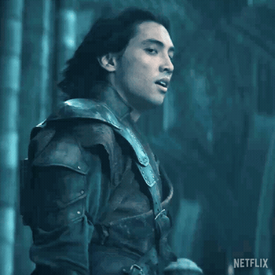 A Man With Long Hair Is Standing In Front Of A Sign That Says " Kill Them All " GIF