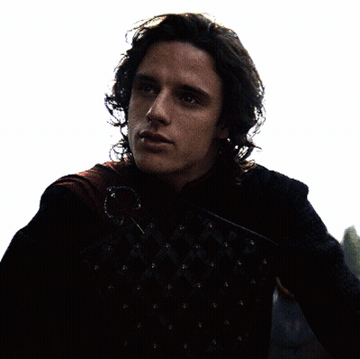 A Man With Long Hair Is Wearing A Black Jacket With Studs GIF