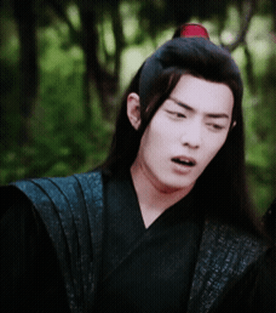 A Man With Long Hair Is Wearing A Black Kimono And A Red Headband GIF